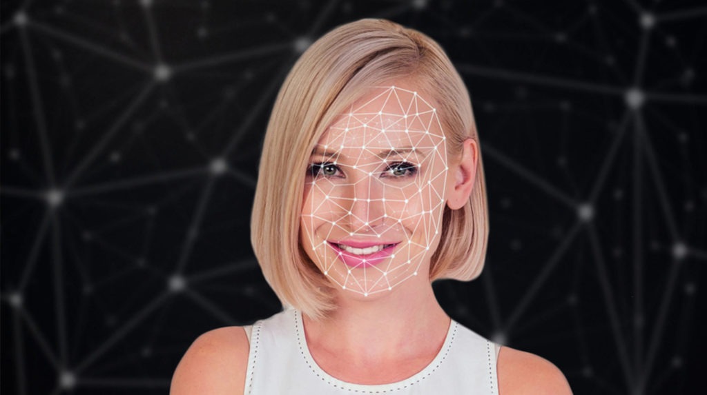 woman's face with facial coding graph superimposed on top