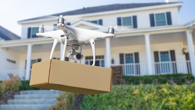 Drone Delivering Package To House